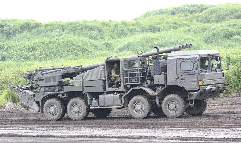 Type 19 truck-mounted howitzer breaks cover in Japan